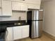 Modern kitchen with stainless steel appliances and a gold faucet at 6529 Bourbon Way, Las Vegas, NV 89107