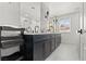 Elegant bathroom featuring a double vanity and large mirror at 6971 Arville St, Las Vegas, NV 89118