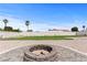 Fire pit area with putting green in background at 6971 Arville St, Las Vegas, NV 89118