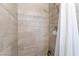 Clean shower with tile surround and curtain at 7009 Rawlins Ct, Las Vegas, NV 89128