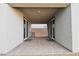 Covered patio with brick pavers and sliding glass doors at 7097 Range Valley St, North Las Vegas, NV 89084