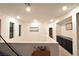 Upstairs hallway with dark cabinets and neutral wall colors at 7097 Range Valley St, North Las Vegas, NV 89084