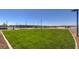 Fenced dog park with grassy area and seating at 7535 Phoenix Falls St # Lot 52, North Las Vegas, NV 89084