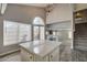 Kitchen island with view into living room and staircase at 8863 Chapman Point, Las Vegas, NV 89129