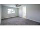 Spacious bedroom featuring a ceiling fan and ample natural light at 909 Smith St, Las Vegas, NV 89108