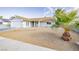 Single story home with a landscaped front yard at 909 Smith St, Las Vegas, NV 89108