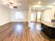 Spacious living room with hardwood floors and a ceiling fan at 10841 Hunters Green Ave, Las Vegas, NV 89166