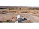 Aerial view showing house, surrounding land, and distant mountains at 1291 Bunnell Ave, Logandale, NV 89021