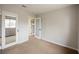 Bright bedroom with mirrored closet doors and neutral walls at 1312 Alderton Ln, Las Vegas, NV 89144