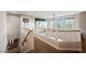 Upstairs hallway with neutral walls, carpet, and a view of a large painting at 1312 Alderton Ln, Las Vegas, NV 89144