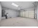 Spacious garage with epoxy floor and ample storage space at 135 Tall Ruff Dr, Las Vegas, NV 89148