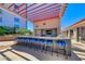 Outdoor kitchen with bar seating and stainless steel appliances at 200 W Sahara Ave # 3207, Las Vegas, NV 89102