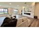 Bright living room with a marble fireplace and large windows at 2250 Shaw Cir, Las Vegas, NV 89117