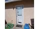 Exterior door with pet door and mini blinds at 2831 Goldrush St, Pahrump, NV 89048