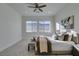 Spacious bedroom with plush carpeting, large windows, and ceiling fan at 3423 Spanish Winds Ct, Las Vegas, NV 89141