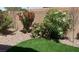 Landscaped backyard with rock and artificial turf at 3506 Judson Ave, Las Vegas, NV 89115