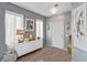 Bright entryway with gray walls, white console table, and hardwood floors at 4127 Neighborly Ct, North Las Vegas, NV 89032