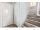 Staircase with light gray walls and wood-look flooring at 4127 Neighborly Ct, North Las Vegas, NV 89032