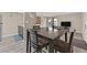 Simple dining area with a dark wood table and four chairs at 5021 River Glen Dr # 47, Las Vegas, NV 89103