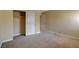 Bedroom with closet and neutral carpeting at 5301 River Glen Dr # 210, Las Vegas, NV 89103