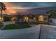 Beautiful home exterior at dusk with landscaping and driveway at 5434 Pendini Point Ct, Las Vegas, NV 89141