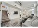 Spacious living room with L-shaped sofa and high ceilings at 61 Tahiti Dr, Henderson, NV 89074