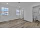 Bright bedroom with wood-look floors and en-suite bathroom at 7640 Sea Wind Dr, Las Vegas, NV 89128