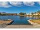 Lake view with boat ramp and Desert Shores community in background at 7640 Sea Wind Dr, Las Vegas, NV 89128