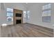 Bright living room with hardwood floors and fireplace at 7640 Sea Wind Dr, Las Vegas, NV 89128