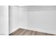 Large walk-in closet with wood-look flooring at 7717 Rainbow Cove Dr, Las Vegas, NV 89131