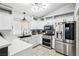 Modern kitchen with white cabinets, stainless steel appliances, and quartz countertops at 9333 Jumpin Juniper Ave, Las Vegas, NV 89129