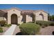 One-story house with arched entryway and neutral color scheme at 2146 Colvin Run Dr, Henderson, NV 89052