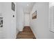 Bright hallway with hardwood floors and white walls at 3478 Bradano Ln, Henderson, NV 89044