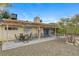 Covered patio with table and chairs, adjacent to house at 4362 Adelphi Ave, Las Vegas, NV 89120