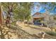 Large backyard with mature trees and gravel at 9615 Stonily Ln, Las Vegas, NV 89178