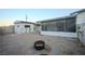 Large backyard with fire pit and detached storage shed at 203 S Texas Ave, Henderson, NV 89015