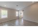 Spacious bedroom with wood-look floors and an ensuite bathroom at 2037 Shining Feather Ln, Las Vegas, NV 89134