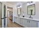 Spa-like bathroom with double sinks, quartz countertops, and a walk-in shower at 2892 Rothesay Ave, Henderson, NV 89044