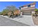 Two-story house with attached garage and driveway at 2892 Rothesay Ave, Henderson, NV 89044