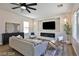 Living room features a neutral color palette, fireplace, and hardwood floors at 2892 Rothesay Ave, Henderson, NV 89044