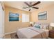 Virtually staged bedroom with ceiling fan, light-colored walls, and windows at 3081 Paladi Ave, Henderson, NV 89044