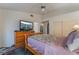 Spacious bedroom with a dresser, TV, and double bed at 3101 Lotus Hill Dr, Las Vegas, NV 89134