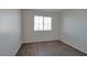 Bedroom with window and wood-look floors at 3953 Rebecca Raiter Ave # 202, Las Vegas, NV 89110