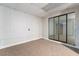 Spacious basement room with mirrored closet doors and neutral carpeting at 5933 Natures Dr, Las Vegas, NV 89122