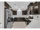 Modern kitchen with dark cabinets and quartz counters at 6110 Scarlet Leaf St, Las Vegas, NV 89148