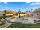 Relaxing pool and spa with a rock waterfall feature at 6460 Spanish Garden Ct, Las Vegas, NV 89110