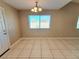 Bright dining area with tile floors and a chandelier at 6524 Ouida Way, Las Vegas, NV 89108