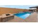 Inviting pool and spa with water features at 8934 Windgate Ranch St, Las Vegas, NV 89166