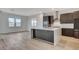 Modern kitchen with large island, stainless steel appliances, and white quartz countertops at 9002 Shifting Skye St, Las Vegas, NV 89166