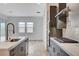 Modern kitchen with dark cabinetry, gas cooktop and stainless steel appliances at 9002 Shifting Skye St, Las Vegas, NV 89166